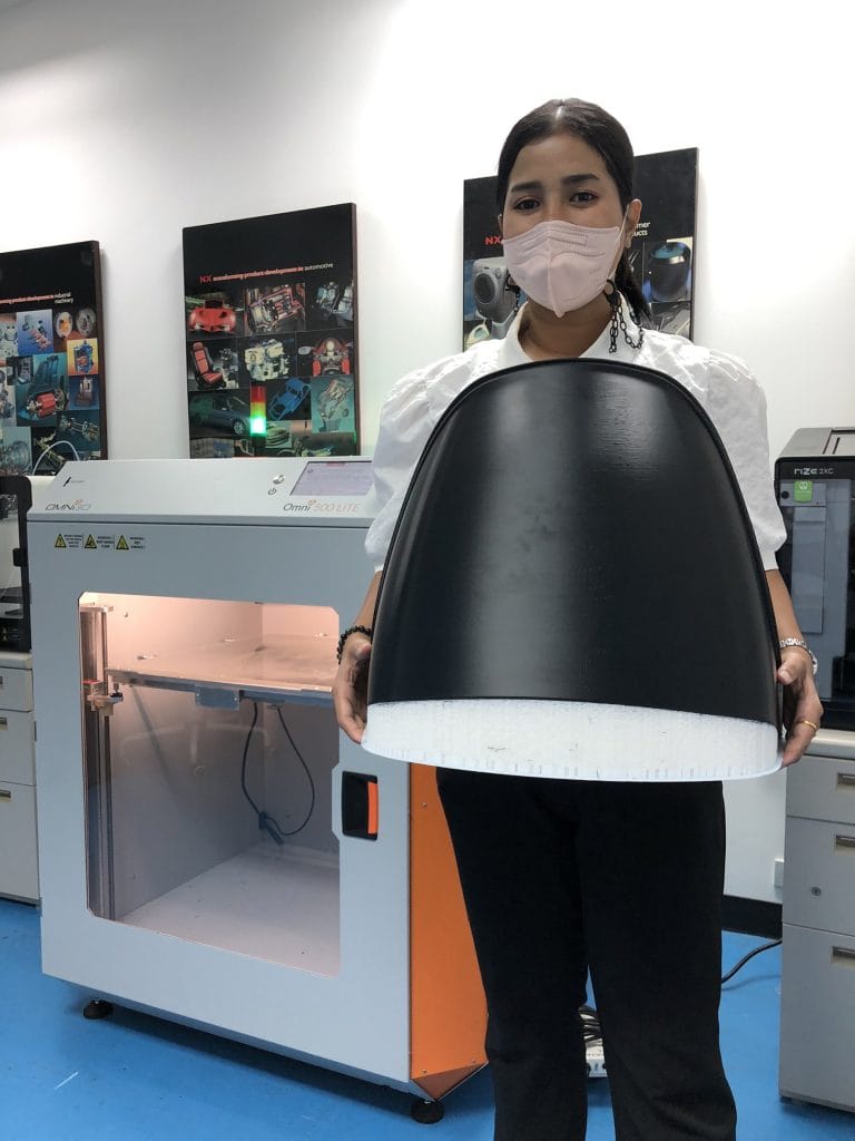 Omni TECH+ industrial 3D printer printing an automotive fender component inside a 70°C controlled heated chamber using ABS-42