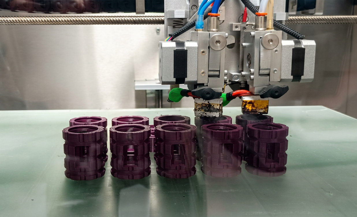 Small-Series 3D-Printed Tooling Small batch of 3D-printed polymer fixtures arranged on a workbench